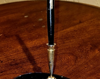 Waterman's Antique  black, lever-fill, 7" tip to nib.  Looks beautiful on your desk in its very own Cobalt colored base (also Waterman's!).