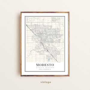 May include: A vintage style map print of Modesto, California. The map shows the city streets and features the coordinates 37°39'41"N 120°59'40"W.