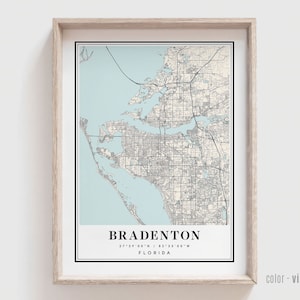 May include: A vintage style map print of Bradenton, Florida. The map is in black and white with a light blue background. The city name and coordinates are printed at the bottom of the map.