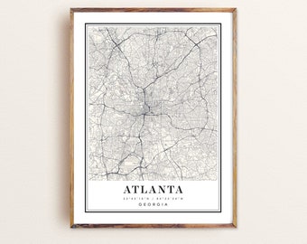 May include: A vintage style map print of Atlanta, Georgia. The map is in black and white and shows the city's streets and landmarks. The text "ATLANTA 33°45'18" N / 84°23'24" W GEORGIA" is printed at the bottom of the map.