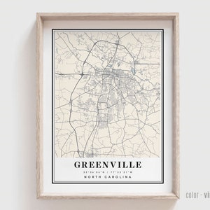 May include: A vintage style map print of Greenville, North Carolina. The map is in black and white with a cream background. The text "GREENVILLE 35°34'58"N / 77°22'31"W NORTH CAROLINA" is at the bottom of the map.