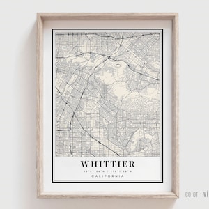 May include: A vintage style map print of Whittier, California. The map is in black and white with a cream background. The city name and coordinates are printed at the bottom of the map.