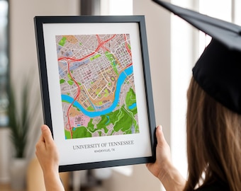 May include: A framed map print of the University of Tennessee campus in Knoxville, Tennessee. The map is in a black frame and shows the campus buildings, roads, and surrounding area.