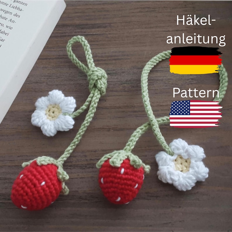 May include: Crocheted strawberry and flower bookmarks. The red strawberries have white seed details and green tops. The white flowers have yellow centers. The bookmarks are connected by a green vine. The image also includes the text "Pattern".