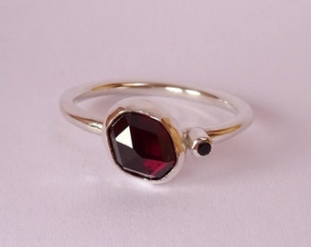 Ring with beautiful red rose cut garnet and black zirconia