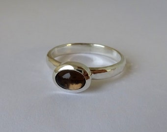 Silver ring with brown oval smoked topaz and hammered ring band