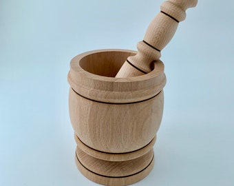 Large mortar and pestle made out of beech wood