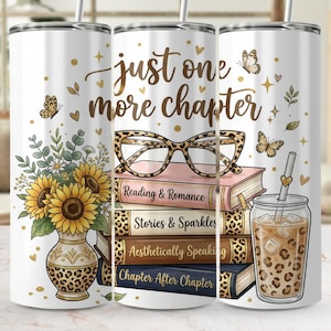 May include: White tumbler with a floral and book-themed design. Features sunflowers in a vase, a stack of books, and a leopard print iced coffee. The text reads "just one more chapter."