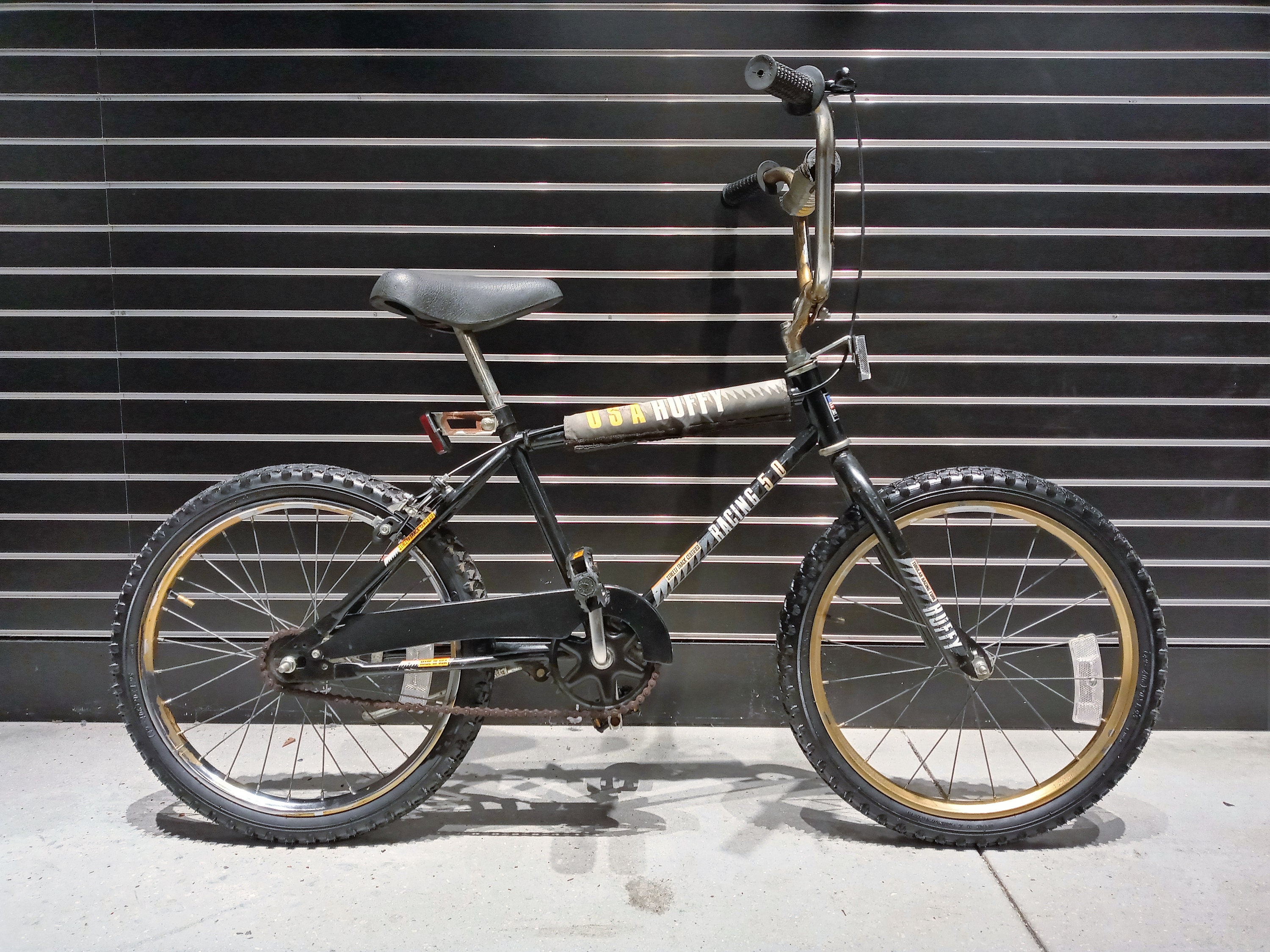 black and gold huffy bike