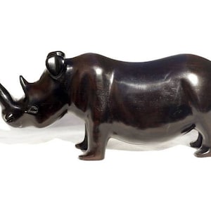 Smooth Zambian Ebony wood handcarved Rhino. Unique African Art Gifts, for home and office decor. Walking Long Horn Rhinoceros figurines.