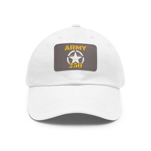 May include: White cotton baseball cap with a brown patch featuring a yellow star and the text "ARMY EST. 1775 250".