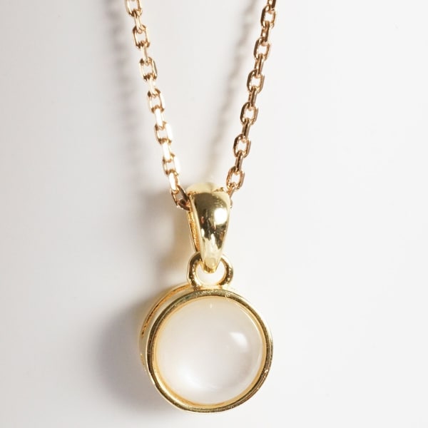 Natural moonstone necklace, white stone on a golden minimalist pendant