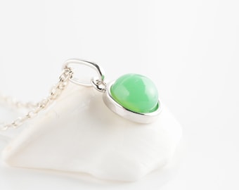 Natural chrysoprase necklace with silver pendant and green cabochon stone.