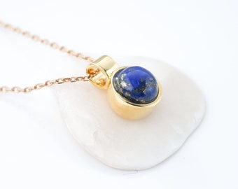 Natural lapis lazuli necklace (cabochon) with pendant and golden chain. Jewel for woman.