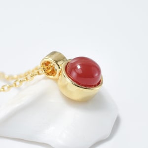 Natural carnelian necklace with golden pendant for women, red stone in cabochon.