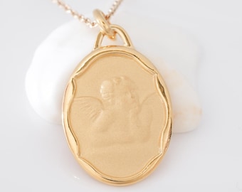 Oval gold angel necklace, gold plated pendant and chain, angel with two wings, delicate jewelry to offer for birthday or Christmas.