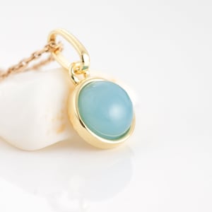 Necklace with a natural blue chalcedony, pendant and golden chain, blue cabochon stone for women.