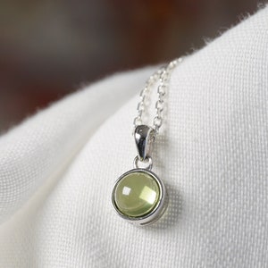 Natural Peridot necklace with silver pendant and cabochon.