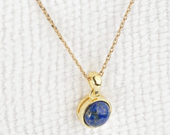 Natural lapis lazuli necklace (cabochon) with pendant and golden chain. Jewel for woman.