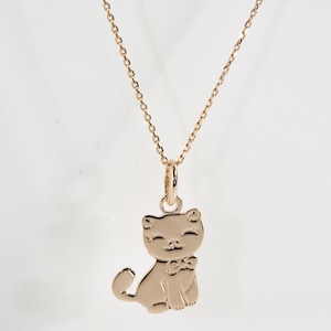 18 carat gold plated cat pendant (as a necklace with a chain).