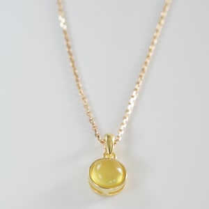 Yellow caledony necklace (natural yellow stone) with golden minimalist pendant.
