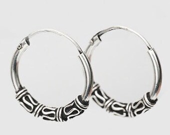 Ethnic style silver hoop earring, or Bali hoop earrings, diameter of 12, 14 and 16 millimeters.