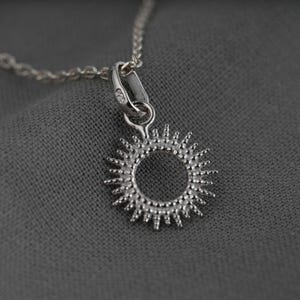 Sun necklace, pendant and chain in silver, a small minimalist jewel for a woman's gift.