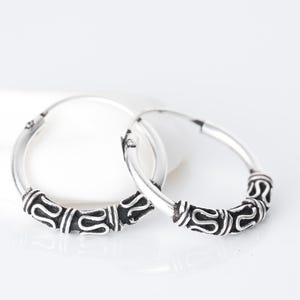Ethnic style silver hoop earrings, or Bali hoops, diameter of 12, 14 and 16 millimeters.