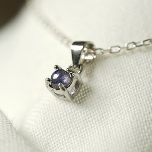 4mm natural iolite necklace in silver. The pendant measures 5mm and the stone 3mm.