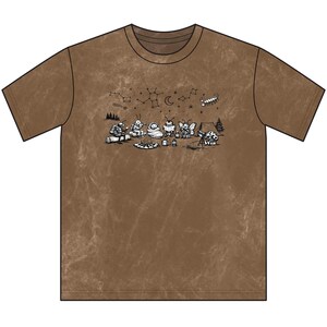 May include: A brown mineral-wash t-shirt featuring a black ink graphic of anthropomorphic insects camping around a fire. The illustration includes a tent, trees, and constellations in the night sky above the insects, with a scorpion and moon.