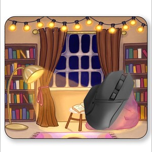 May include: A black computer mouse with a pink and purple beanbag chair in a cozy room with bookshelves, a window, and string lights.