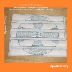 May include: Five white fabric strips with a green embroidered design of a circle divided into sections. The design is repeated on each strip. The strips are arranged vertically, with the top strip at the top of the image and the bottom strip at the bottom of the image. The text "5x7 hoop" is visible in the lower right corner of the image.
