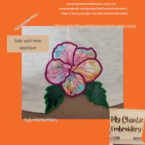 May include: A white t-shirt with a colorful embroidered hibiscus flower applique. The text "Side split hem applique" is above the flower and "My Chaotic Embroidery" is below the flower.