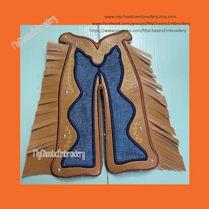 May include: Brown leather chaps with fringe, blue denim accents, and yellow stitching. The chaps are embroidered with the text "MyChaoticEmbroidery".