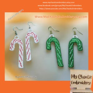 May include: Three pairs of candy cane earrings. One pair is red and white, one pair is green and white, and one pair is green and white. The earrings are made of embroidered fabric and are hanging from silver hooks.