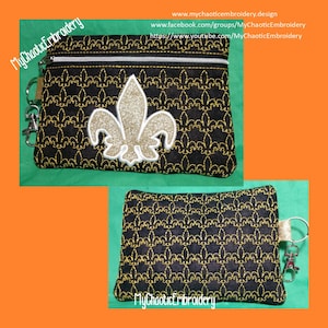 May include: A black zippered pouch with a gold fleur-de-lis design and a gold chain with a key ring. The pouch has the text "MyChaoticEmbroidery" on it.