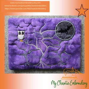 May include: Purple embroidered fabric with a Halloween theme. Features an owl, bare tree branches, a full moon with a bat silhouette, and the text "My Chaotic Embroidery".