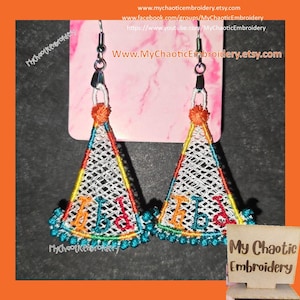 May include: A pair of white, triangular earrings with colorful embroidery. The earrings feature the word "Happy" in a rainbow of colors. The earrings are hanging from silver hooks.