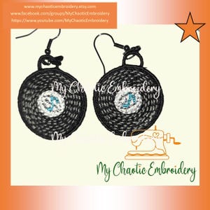 May include: A pair of black and white embroidered earrings shaped like a pool ball with the number 8 on it. The earrings are hanging from silver hooks. The earrings are on a white background with the text "My Chaotic Embroidery" in orange.