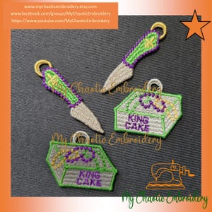 May include: Embroidered patches featuring a knife and King Cake box design. The knife patches have a silver blade with green and purple accents. The King Cake box patches are gray with green trim and the words "KING CAKE".