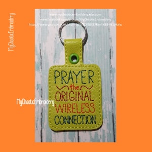 May include: A lime green rectangular keychain with the text "PRAYER the ORIGINAL WIRELESS CONNECTION" embroidered in black and red thread. The keychain has a silver metal ring and a green snap closure.