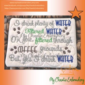 Pode incluir: Quadrado branco bordado com o texto "I drink plenty of WATER, Filtered WATER, OK fine, filtered through COFFEE grounds, But, yes, I drink WATER." Acentos de grãos de café e florais. O nome da loja Etsy também é visível.