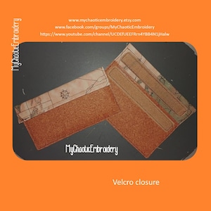 May include: A brown leather wallet with a map design and a velcro closure. The wallet has two card slots and a larger pocket for cash. The text "MyChaoticEmbroidery" is printed on the wallet.
