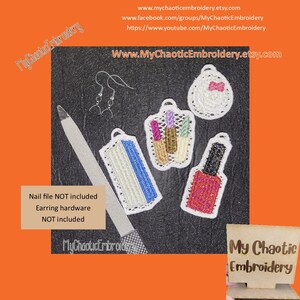 May include: Five embroidered designs for a nail salon or beauty shop. The designs include a nail file, a bottle of nail polish, a lipstick, and two earrings. The designs are white with colourful details. The text "My Chaotic Embroidery" is visible in the image.