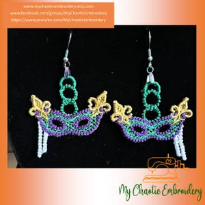 May include: A pair of green, purple, and gold Mardi Gras mask earrings with white beads hanging from the bottom.