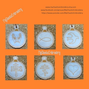 May include: Six white felt ornaments with gold embroidery. The ornaments feature religious symbols including a dove, a fish, a cross, a heart, and the word "IHS".