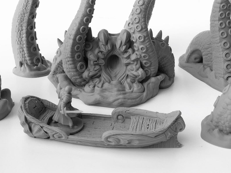 May include: A gray 3D printed miniature set depicting a scene of a boat with a figure in a cloak and sword, being pulled into the mouth of a large octopus monster.