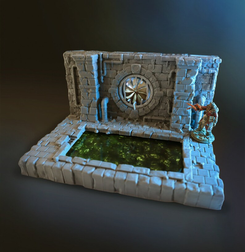 May include: A gray, stone-like miniature dungeon set with a green, mossy pool and a round, metal vent. The set is designed for tabletop gaming.