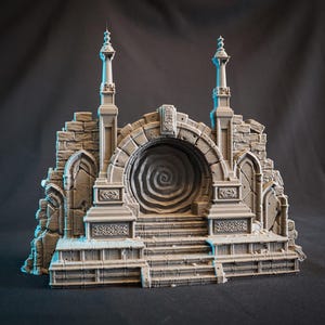 May include: A 3D printed miniature of a ruined stone archway with a swirling portal in the center. The archway is flanked by two towers with pointed tops. The base of the archway is a set of steps.