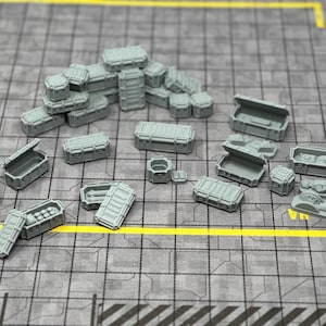 May include: A collection of gray plastic crates and boxes of various sizes. Some of the crates are stacked on top of each other, while others are scattered around. The crates are all closed and have a simple design.